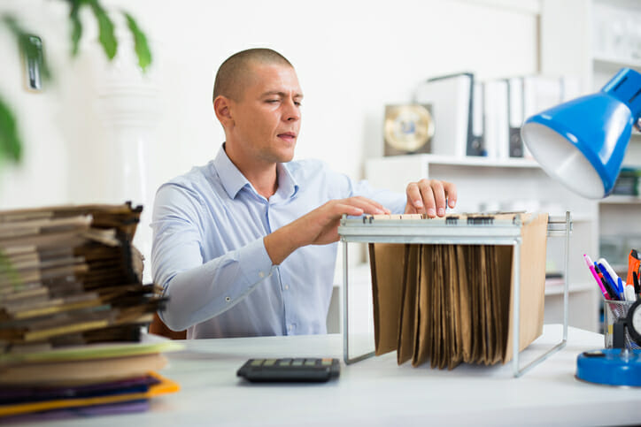 a man using a workable filing system