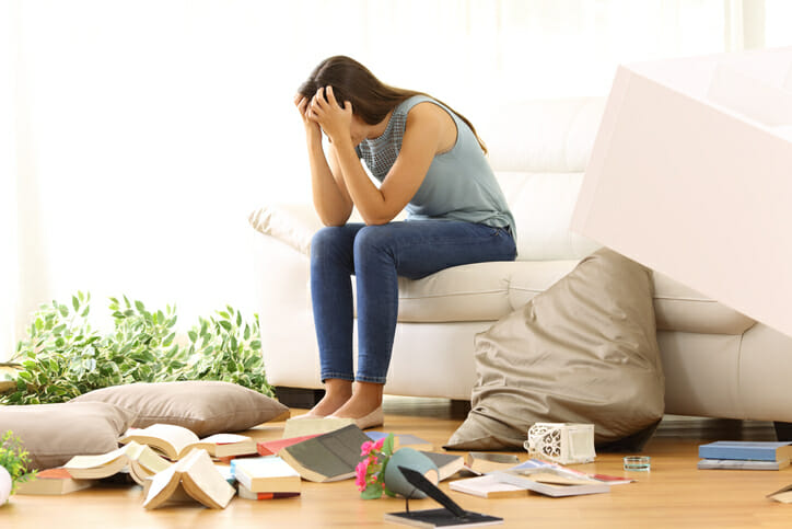 a fatigued woman looking at clutter